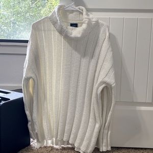 Knit sweater, turtleneck, soft, and white. Perfect for fall/winter weather.